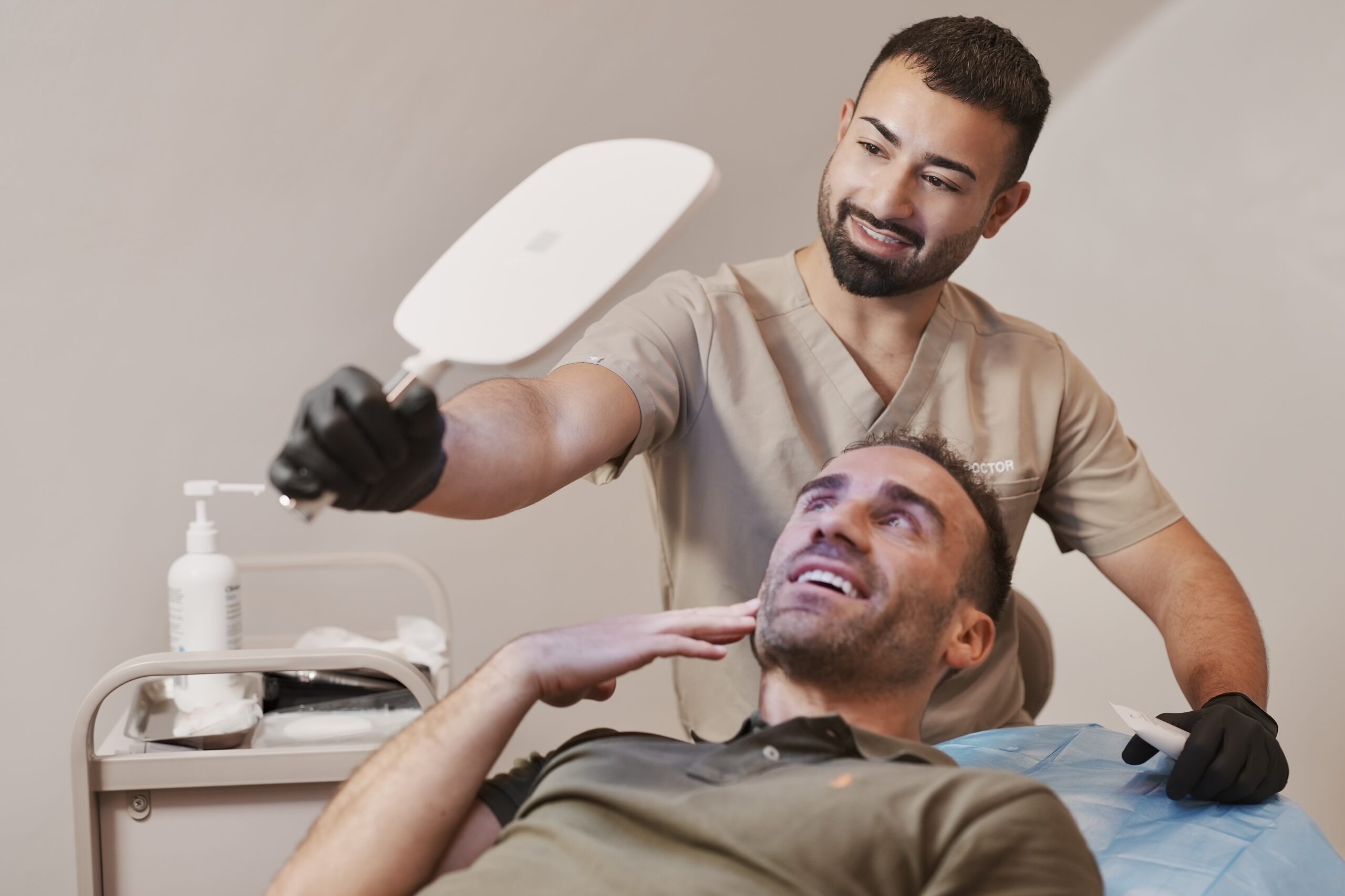 Dr Sana from The Sana Clinic treating male patient