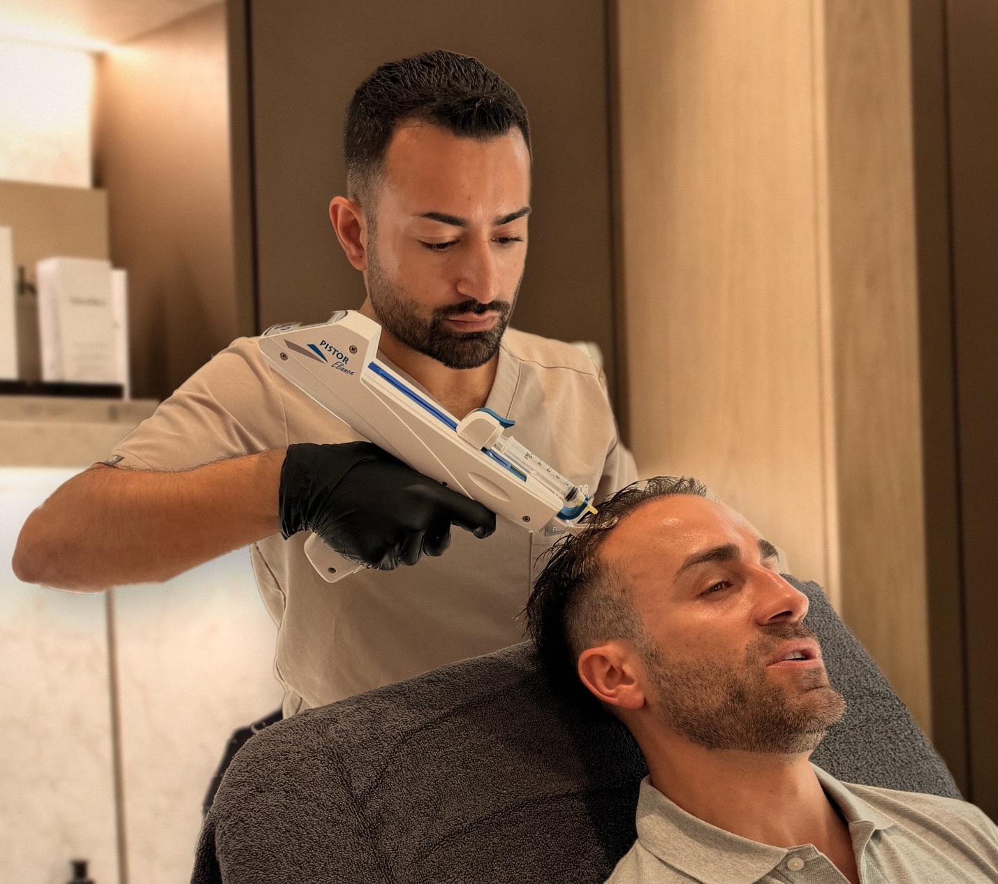Dr Sana performing hairloss PRP, PRF and polynucleotide protocol treatment on male patient using mesotherapy gun